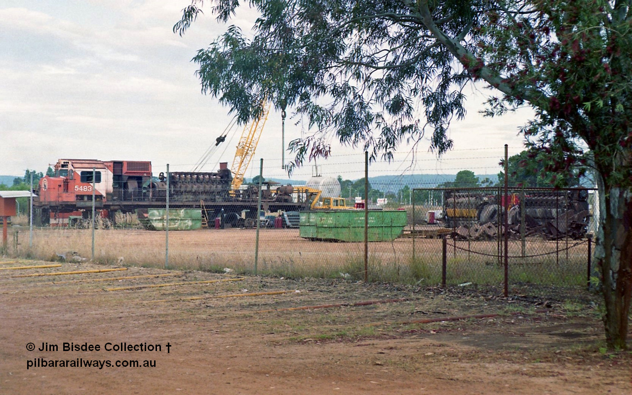 16954
Bassendean, the rear of Goninan's workshops, Mt Newman Mining's AE Goodwin built ALCo M636 unit 5483 serial G6061-4 being prepped for rebuilding into 5659 with the 251 engine and alternator visible and other 251's to the right. October 1993.
Jim Bisdee photo.
Keywords: 5483;AE-Goodwin;ALCo;M636C;G6061-4;