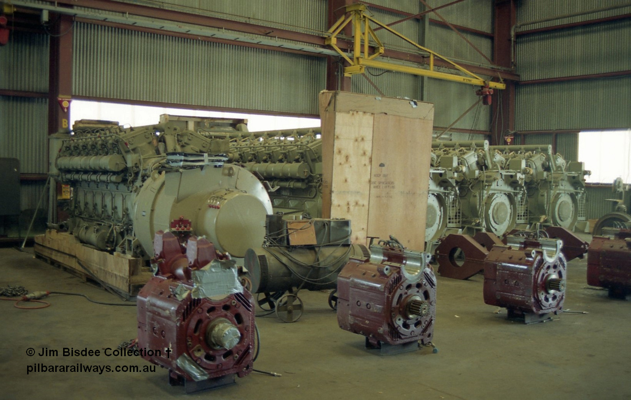 22666
Bassendean, during an Open Day at the Goninan workshops, new GE-7FDL-16 prime-movers, some with GMG187 main alternators for install into a GE CM40-8M rebuilds and some GE752 AH traction motors. 20th July 1991.
Jim Bisdee photo.
