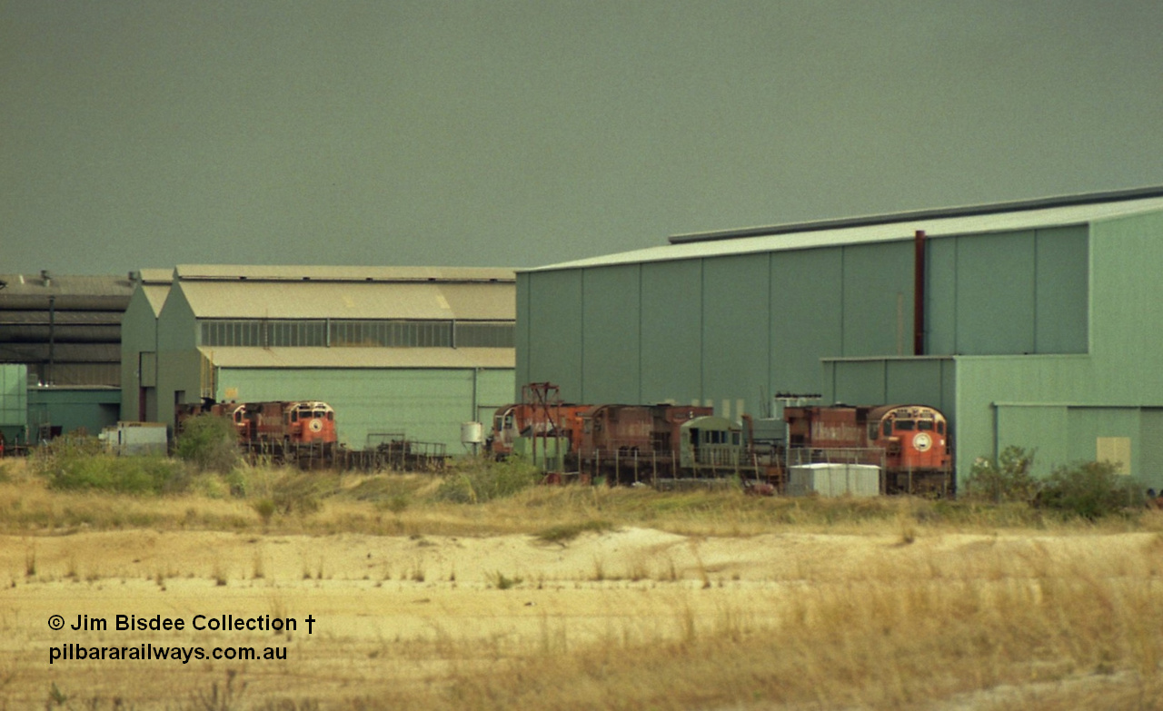 22927
Bassendean, Goninan workshops, view of several Mt Newman Mining ALCo units awaiting rebuilding or scrapping. November 1992.
Jim Bisdee photo.

