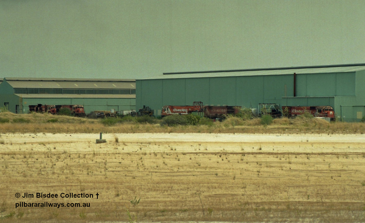 22928
Bassendean, Goninan workshops, view of several Mt Newman Mining ALCo units awaiting rebuilding or scrapping. November 1992.
Jim Bisdee photo.
