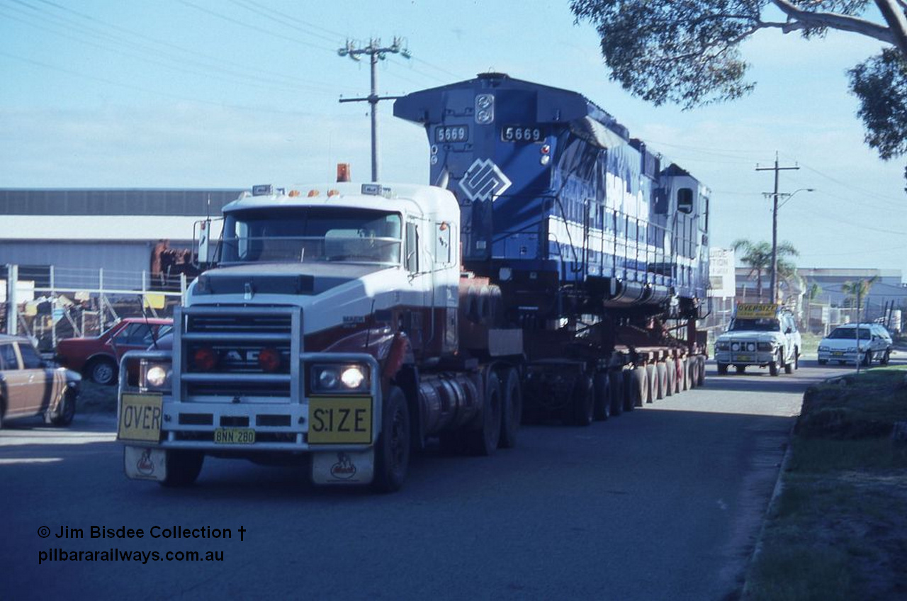 3584 001
Bassendean, Wood St, delivery of the final BHP CM40-8MEFI unit 5669 'Beilun' serial 8412-02 / 95-160. Unit was rebuilt as one of three with an electronic fuel injected prime mover by Goninan from Comeng built ALCo M636 unit 5486 serial C6084-2. Date July 1995.
Jim Bisdee photo.
Keywords: 5669;Goninan;GE;CM40-8EFI;8412-02/95-160;rebuild;Comeng-NSW;ALCo;M636C;5486;C6084-2;