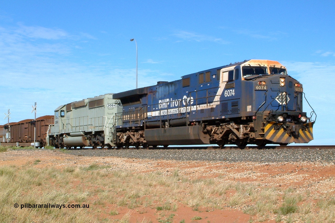040502 091608r
Bing Siding, BHP GE AC6000 6074 'Kalgan' serial 51066 leading EMD SD40-2 3084 serial 786263-35 originally Union Pacific UP 3643 at the 15.4 km grade crossing with a loaded Yandi train 2nd May 2004.
Keywords: 6074;GE;AC6000;51066;