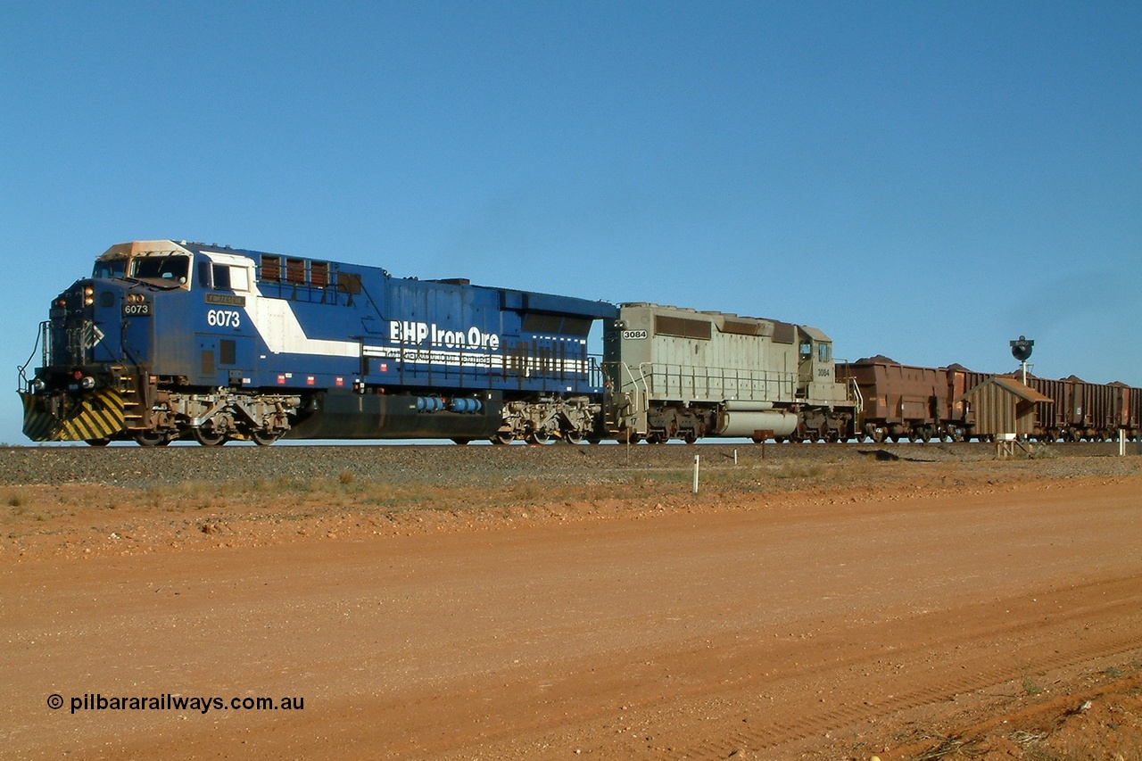 040802 155428r
Bing Siding, BHP GE AC6000 locomotive 6073 'Fortescue' leads EMD SD40-2 unit 3084 serial 786263-35 originally Union Pacific UP 3643 with a loaded train running through Bing 2nd August 2004.
Keywords: 6073;GE;AC6000;51065;