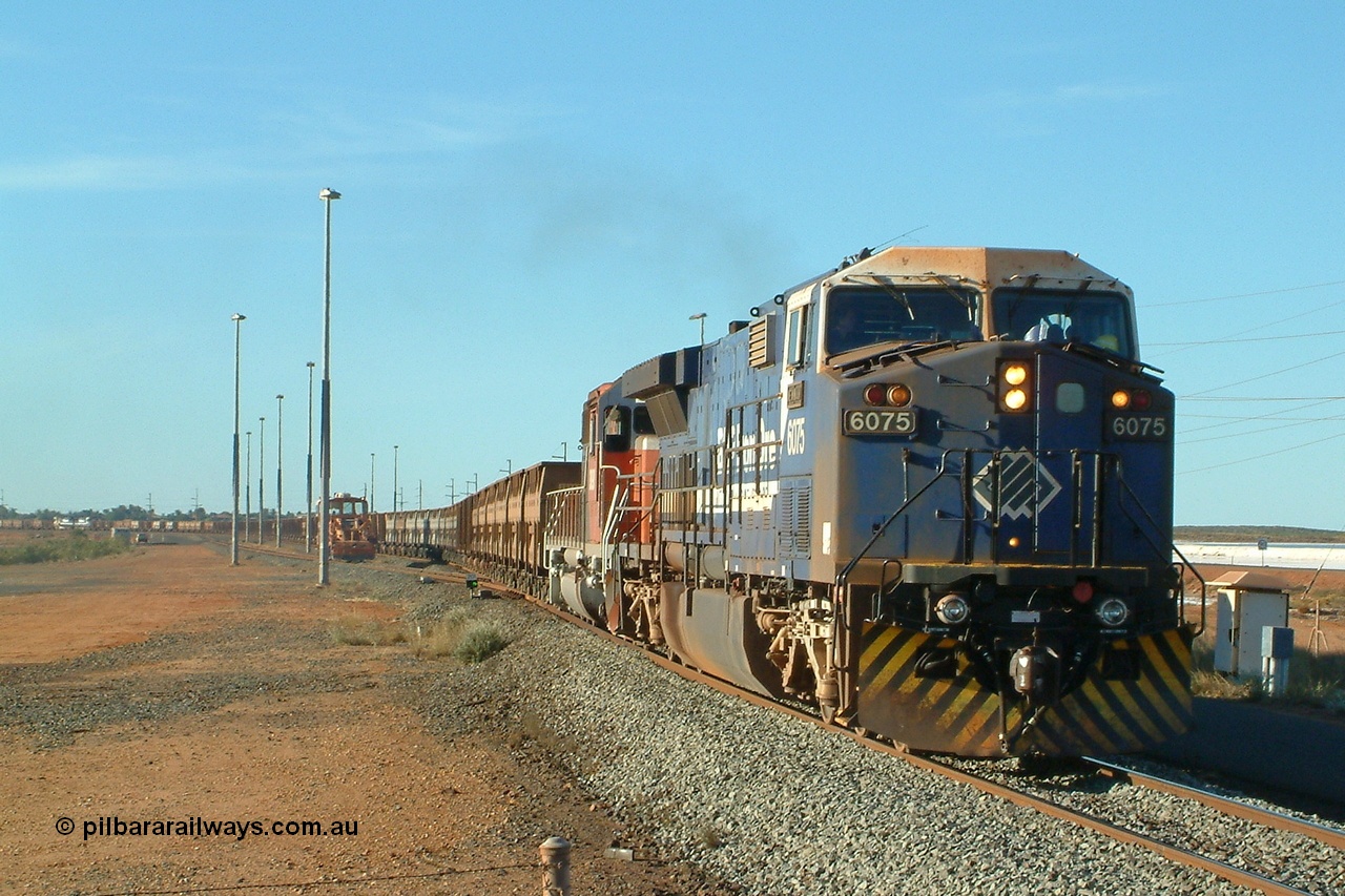 040809 162852r
Nelson Point, BHP GE AC6000 6075 'Newman' serial 51067 and EMD SD40R 3090 serial 33680 originally Southern Pacific SD40 SP 8488 depart the yard with the 1630 hrs departure on 9th August 2004. The mid-train units 5660 and 5656 can be just seen in picture.
Keywords: 6075;GE;AC6000;51067;