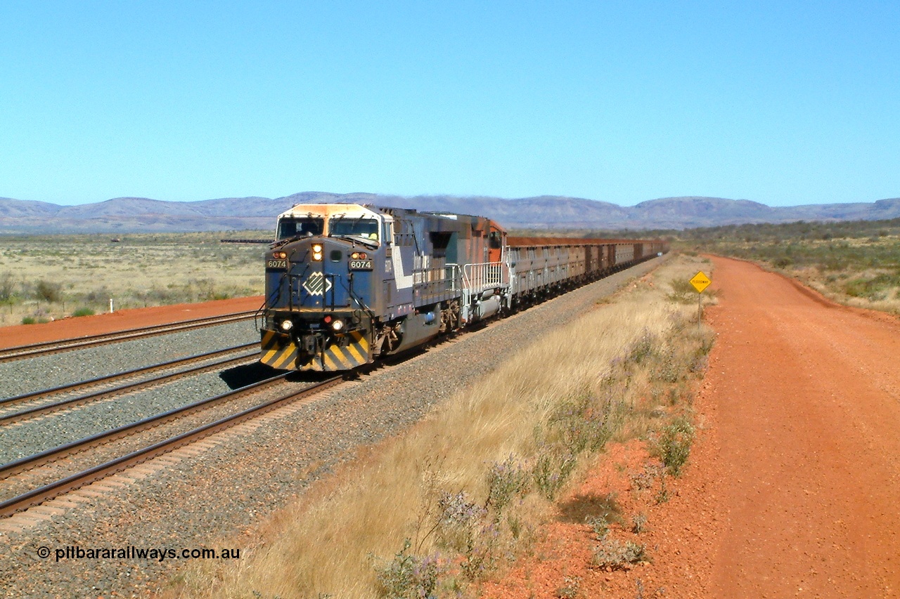 040810 123248r
Cowra Siding, BHP GE AC6000 6074 'Kalgan' serial 51066 leading EMD SD40R 3088 serial 31513 originally Southern Pacific SD40 SP 8432 with a loaded train through the mainline at the newly reinstated siding of Cowra, located at the 249 km 10th August 2004.
Keywords: 6074;GE;AC6000;51066;