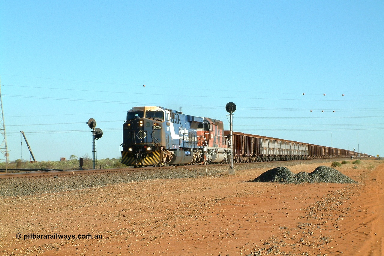 040811 161635r
Goldsworthy Junction, BHP GE AC6000 class leader 6070 'Port Hedland' serial 51062 runs through the junction leading EMD model SD40R unit 3089 serial 31512 formally Southern Pacific SD40 SP 8431 with a loaded Yandi train 11th August 2004.
Keywords: 6070;GE;AC6000;51062;
