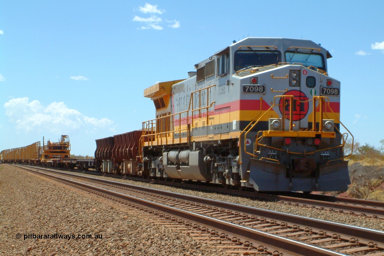 050110 135546r
Ibis Siding, the highest numbered Hamersley Iron owned General Electric built Dash 9-44CW unit 7098 serial 54161 from the fourth order in 2003 in the Pilbara Rail livery leads a works train of ballast and rail waggons into the passing track to meet a loaded train. 10th January 2005.
Keywords: 7098;GE;Dash-9-44CW;54161;