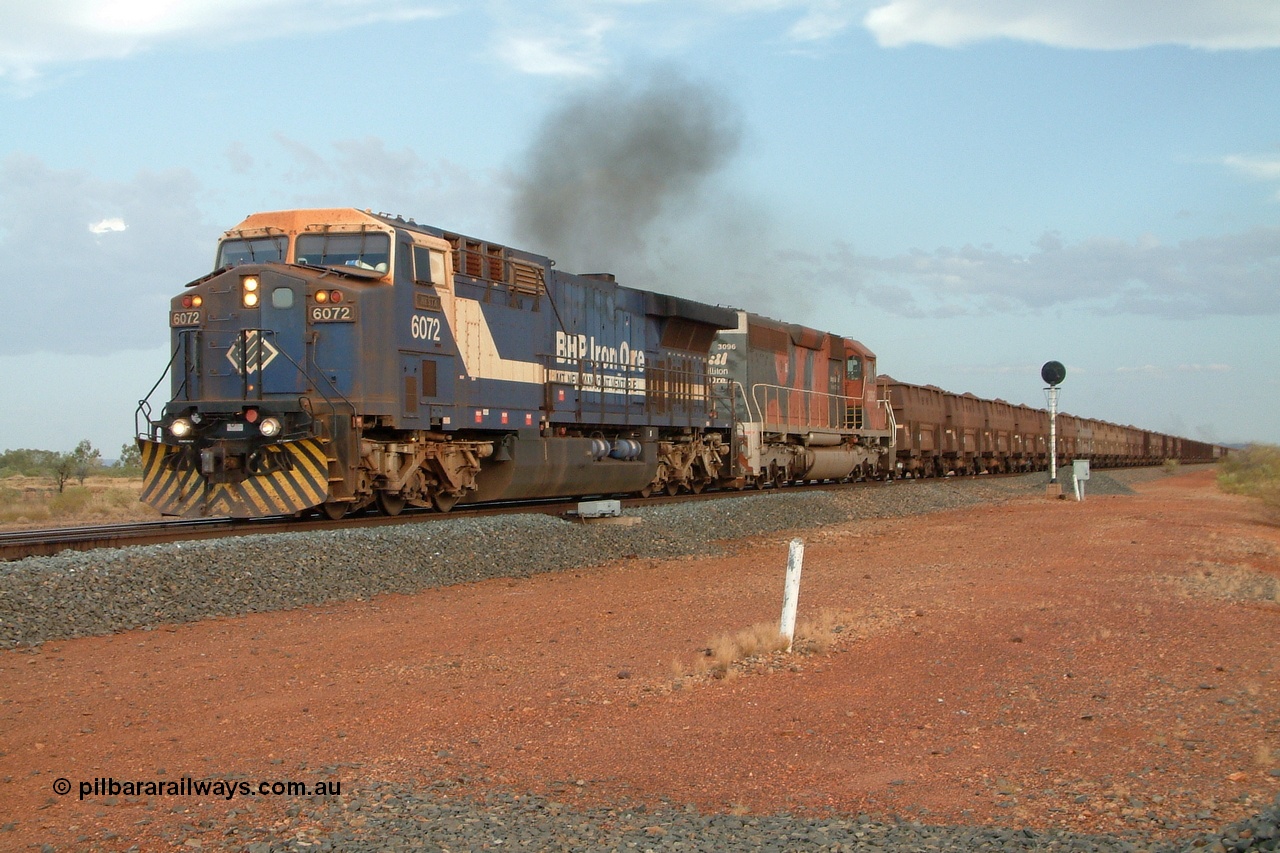 050130 171954r
Gillam Siding, BHP GE AC6000 6072 'Hesta' serial 51064 heads up a 300 waggon train with SD40R unit 3096 serial 31510 originally Southern Pacific SD40 SP 8429 power north away from Gillam 30th January 2005.
Keywords: 6072;GE;AC6000;51064;