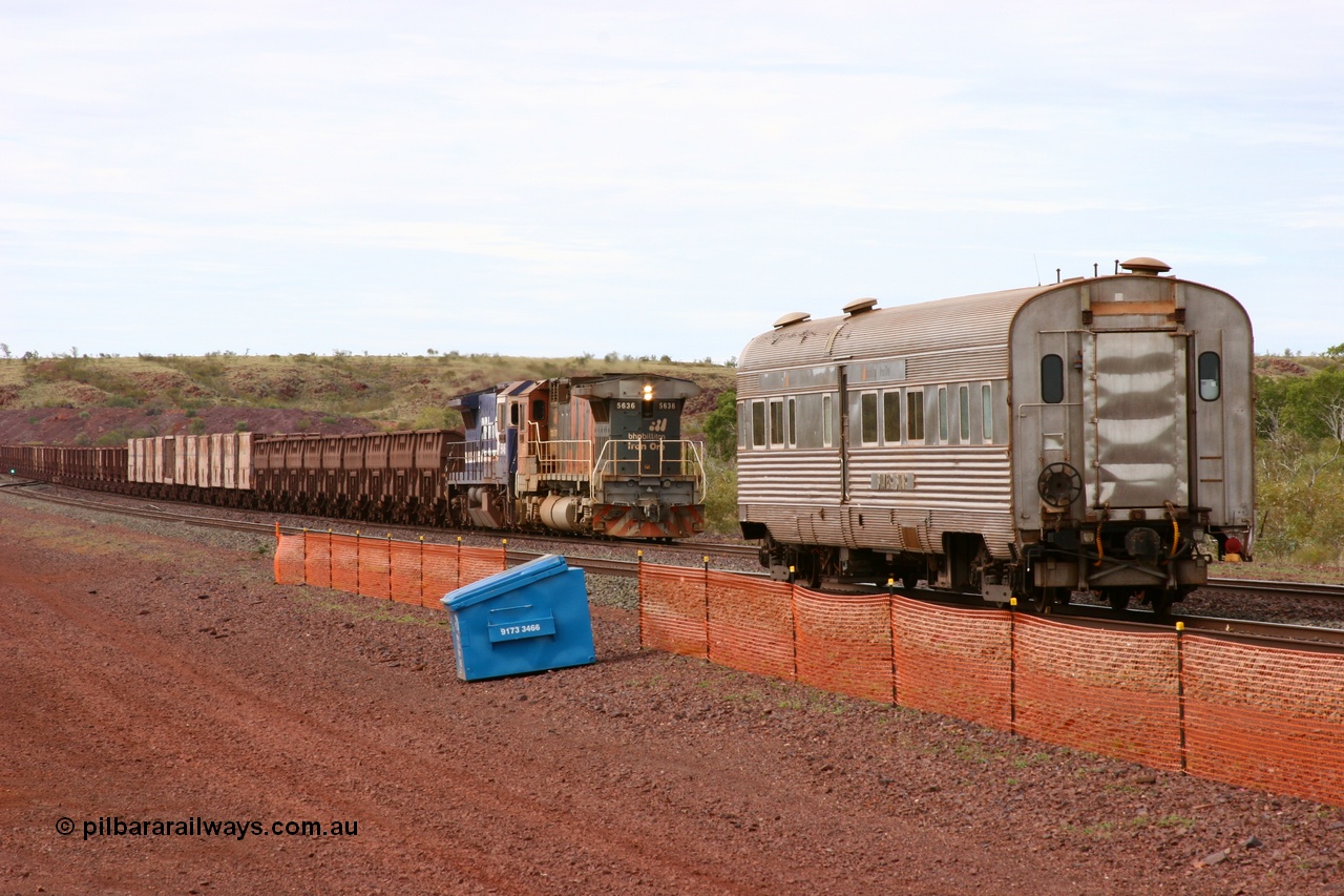 050624 3368
Goldsworthy Siding 110.8 km on the GML sees BHP Billiton Goninan GE rebuilt model CM40-8M unit 5636 'Munda' serial 8151-11 / 91-122 leading long end on a loaded Yarrie ore train assisting CM40-8 5646 past the Sundowner 24th June 2005. 
Keywords: 5636;Goninan;GE;CM40-8M;8151-11/91-122;rebuild;AE-Goodwin;ALCo;C636;5462;G6035-3;