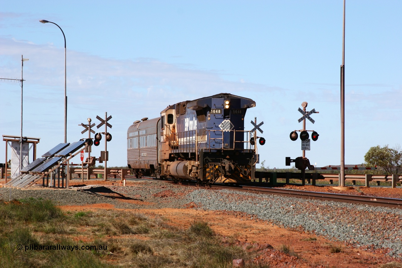 050625 3768
Broome Rd grade crossing at the 57.1 km on the GML sees BHP Goninan GE rebuilt model CM40-8M unit 5648 'Kwangyang Bay' serial 8412-06 / 93-139 long end leading the Sundowner on its way back to Hedland across the highway 25th June 2005.
Keywords: 5648;Goninan;GE;CM40-8M;8412-06/93-139;rebuild;AE-Goodwin;ALCo;M636C;5477;G6047-9;