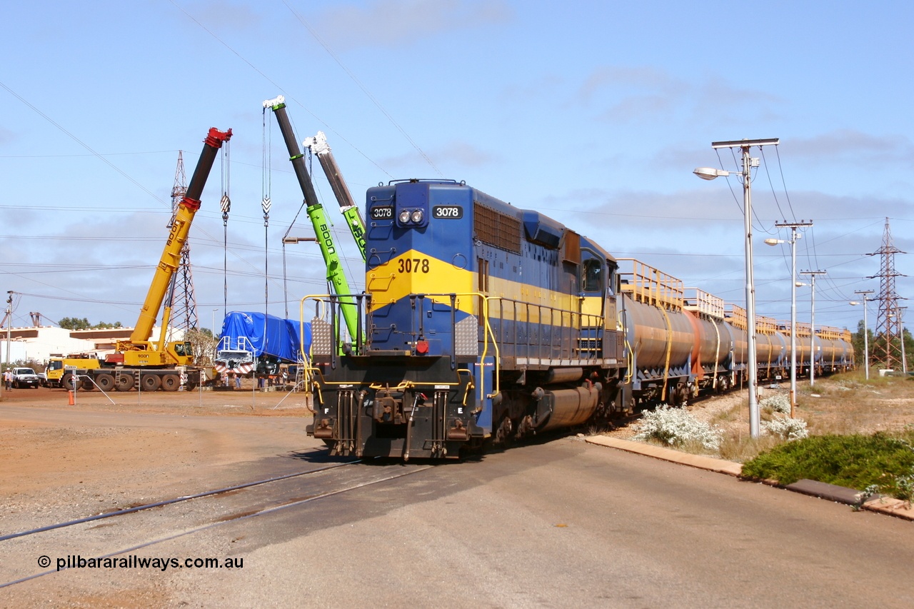 051023 6215r
Nelson Point, BHP Billiton EMD built SD40 unit 3078 built February 1966 serial 31503 / 7861-13 still in previous owner IC & E blue and yellow runs out of the fuel gantry with loaded tank waggons as Electro-Motive (EMD successor) built SD70ACe/LC unit 4305 is lowered onto the rails. 23rd October 2005.
Keywords: 3078;EMD;SD40;31503/7861-13;SP8422;