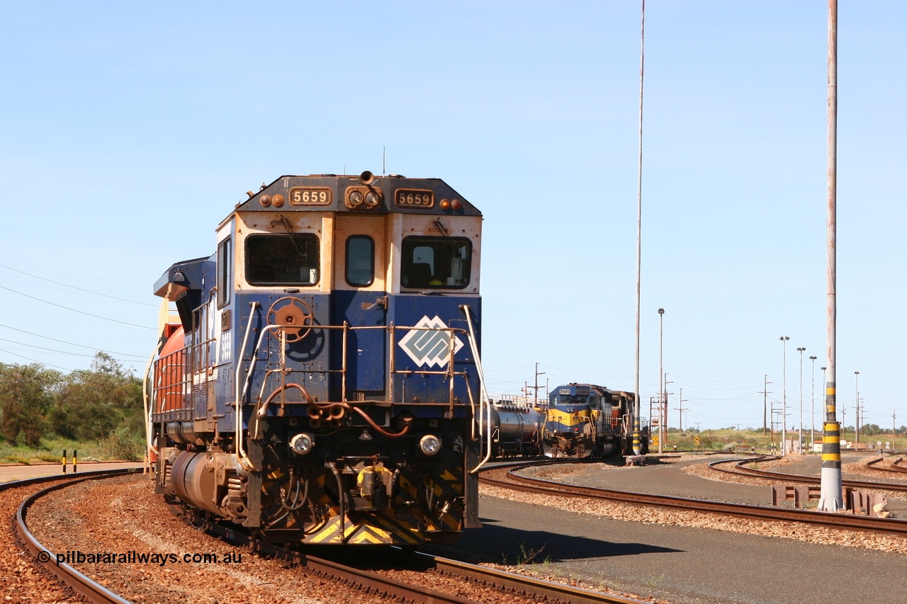 060415 3450r
Nelson Point yard, BHP Goninan GE rebuild CM40-8M 5659 'Kobe' serial 8412-04 / 94-150 with a rake of loaded 100 kL fuel waggons waiting access to shunt for the evening departure and Yard Pilots EMD SD40 units 3080 and 3091 15th April 2006.
Keywords: 5659;Goninan;GE;CM40-8M;8412-04/94-150;rebuild;AE-Goodwin;ALCo;M636C;5483;G6061-4;