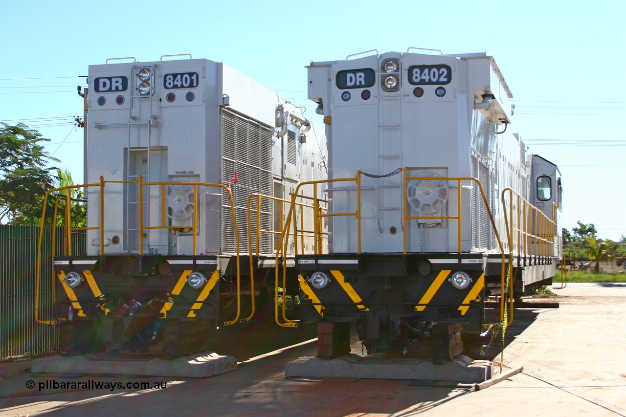 070501 9016r
Wedgefield, sitting in Asset Kinetics yard waiting to start construction duties are two of the four GTSA rebuilt DR class units. Comeng WA ALCo rebuild C636R model DR 8401 'Jean' serial WA143-1 and ex Robe River ALCo #9426 original serial 3499-02 and Comeng WA ALCo rebuild C636R model DR 8402 'Margaret' serial WA135 / C6011-02 and ex Hamersley Iron C636 #3007 with the differences between the Phase II and Phase III radiators of the Comeng WA ALCo rebuild models evident. 1st May 2007.
Keywords: DR-class;DR8401;Comeng-WA;C636R;WA143-1;9426;rebuild;ALCo;Schenectady-NY;C636;Conrail;6782;3499-3;