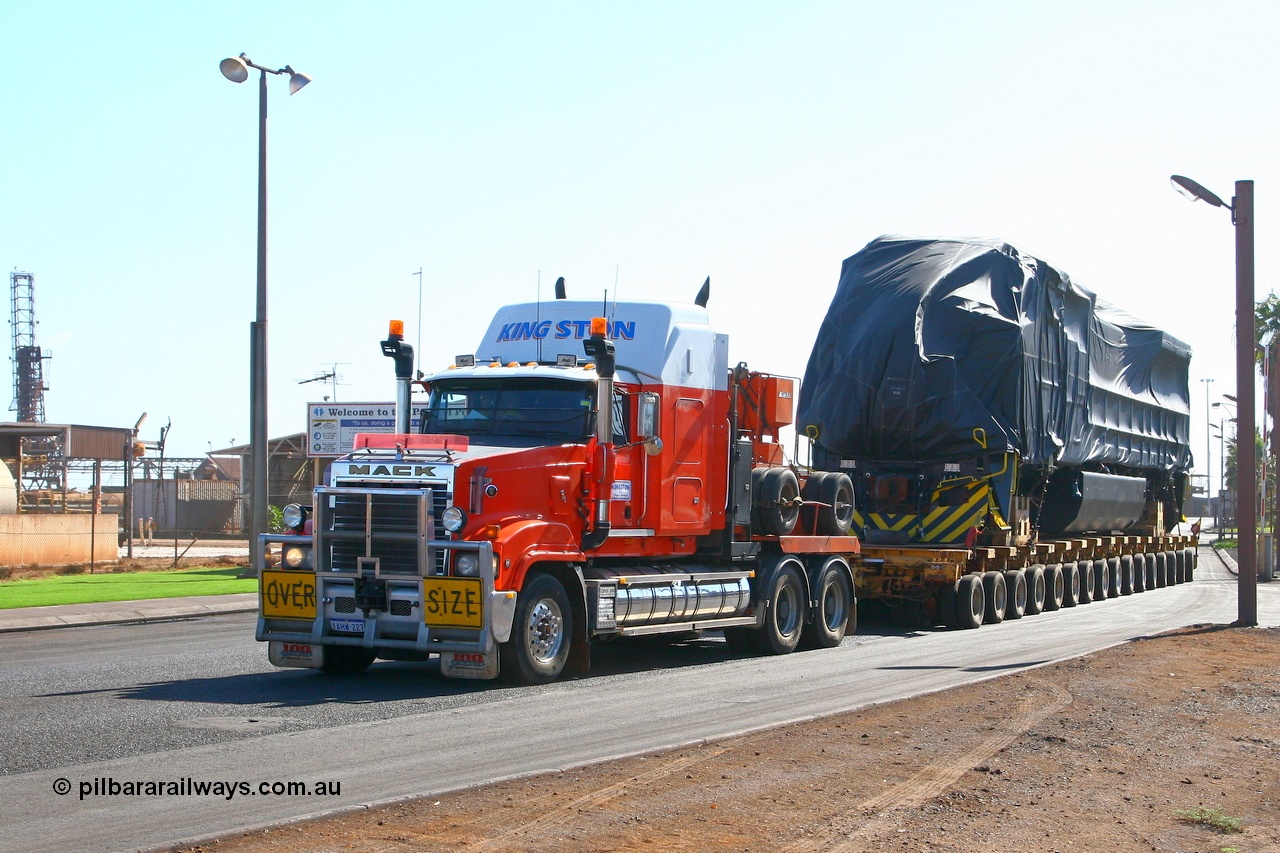 071101 1114r
Port Hedland, Gilbert Street, Kingston Transport leave the Hedland Port terminal with another FMG General Electric built Dash 9-44CW loco off the good ship BBC Kusan. Thursday 1st November 2007.
Keywords: GE;Dash-9-44CW;