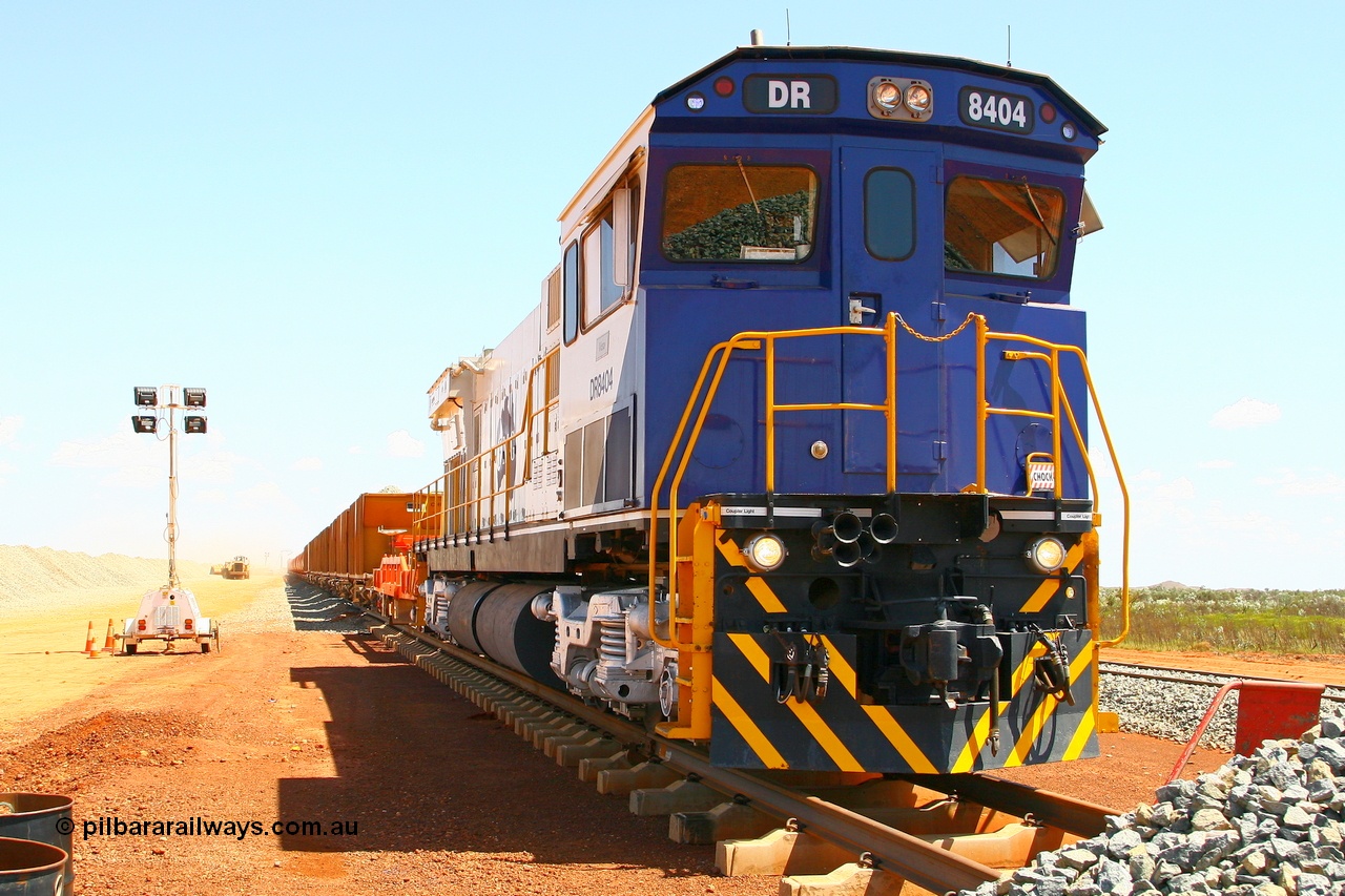 080118 1412r
Barker Siding, Comeng ALCo rebuild C636R model DR 8404 'Vera' serial WA135 / C6040-1 was rebuilt from Hamersley Iron 3013 an ALCo C636. Here it idles away on a ballast train during loading for the afternoon ballast run, DR 8403 is on the other end. 18th January 2008.
Keywords: DR-class;DR8404;Comeng-WA;ALCo;C636R;WA135/C6040-1;