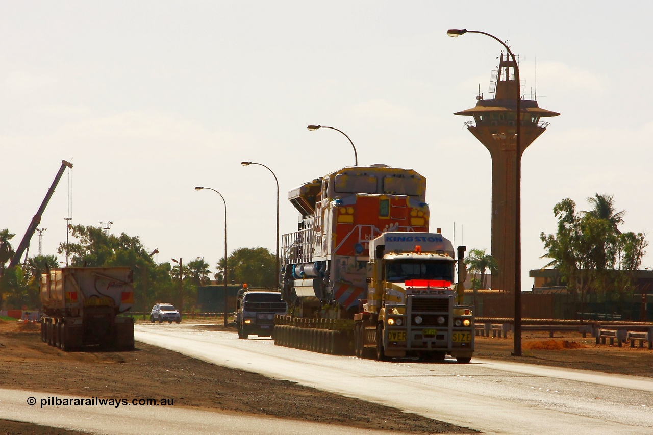 090113 0757
Port Hedland, brand new Electro-Motive built SD70ACe/LC unit 4345 serial 20078915-012 leaves the port of Port Hedland and heads for Nelson Point to put placed on rails. Kingston Transport provide the 128 wheel floats and prime movers. 13th January 2009.
Keywords: 4345;Electro-Motive;EMD;SD70ACe/LC;20078915-012;