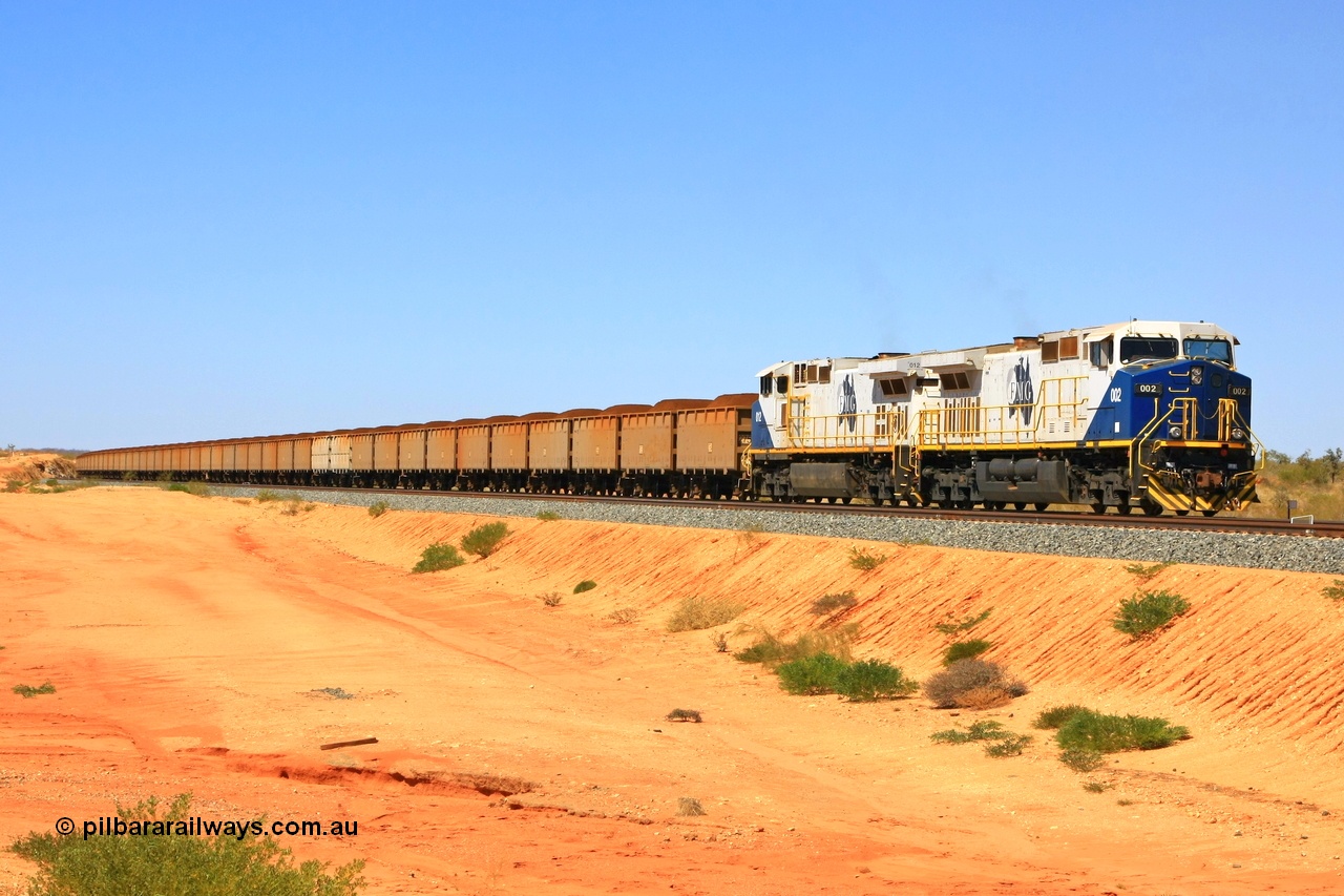 090814 2084r
Hunter Siding, FMG's General Electric Dash 9-44CW locomotives 002 serial 58179 and 012 serial 58189 leading 240 loaded waggons hold the mainline waiting to cross an empty train. 14th August 2009.
Keywords: FMG-002;GE;Dash-9-44CW;58179;