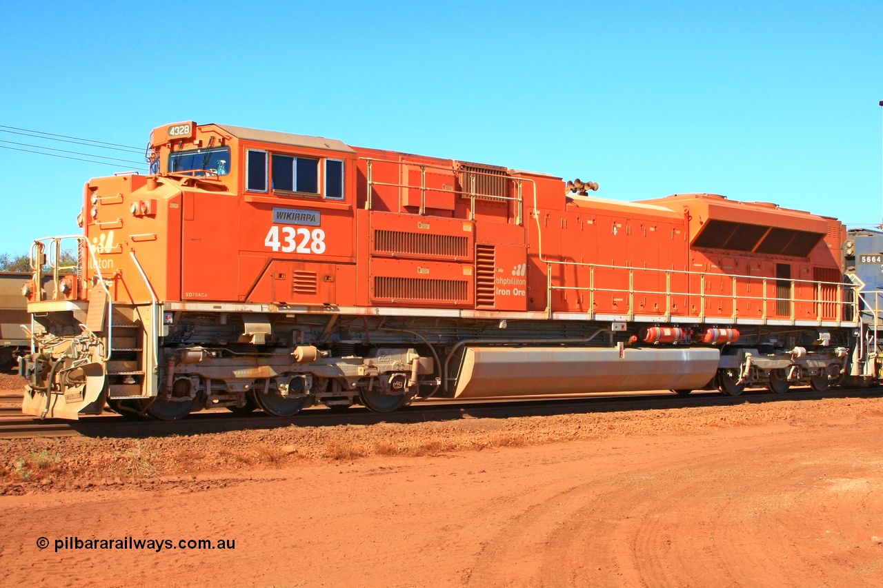 100508 8319r
Nelson Point, BHP Billiton 'Pumpkin' unit 4328 was built by Electro-Motive as an EMD model SD70ACe for the BNSF railroad in the USA with serial 20066862-057 but was sold to BHP while under construction as one of ten similar units to be diverted to BHP in an all over BNSF base orange earning them the nickname of 'pumpkins' after the BNSF livery. They were standard US domestic units and required substantial modifications to be afforded lead unit status for BHP. This view shows the tropical roof, marker lights, fire suppression tanks and dual handrail. 8th May 2010.
Keywords: 4328;Electro-Motive-London-Ontario;EMD;SD70ACe;20066862-057;BNSF-9186
