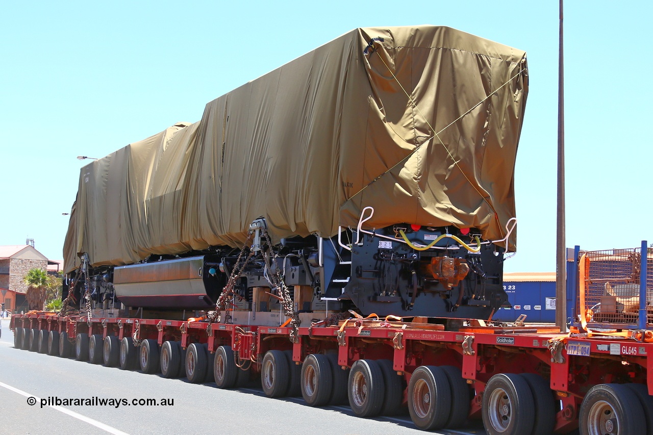 150131 7690
Port Hedland, Wilson Street, view of Roy Hill's General Electric built ES44ACi unit RHA 1014 serial 62586 still under tarp during delivery 31st January 2015.
Keywords: RHA-class;RHA1014;GE;ES44ACi;62586;