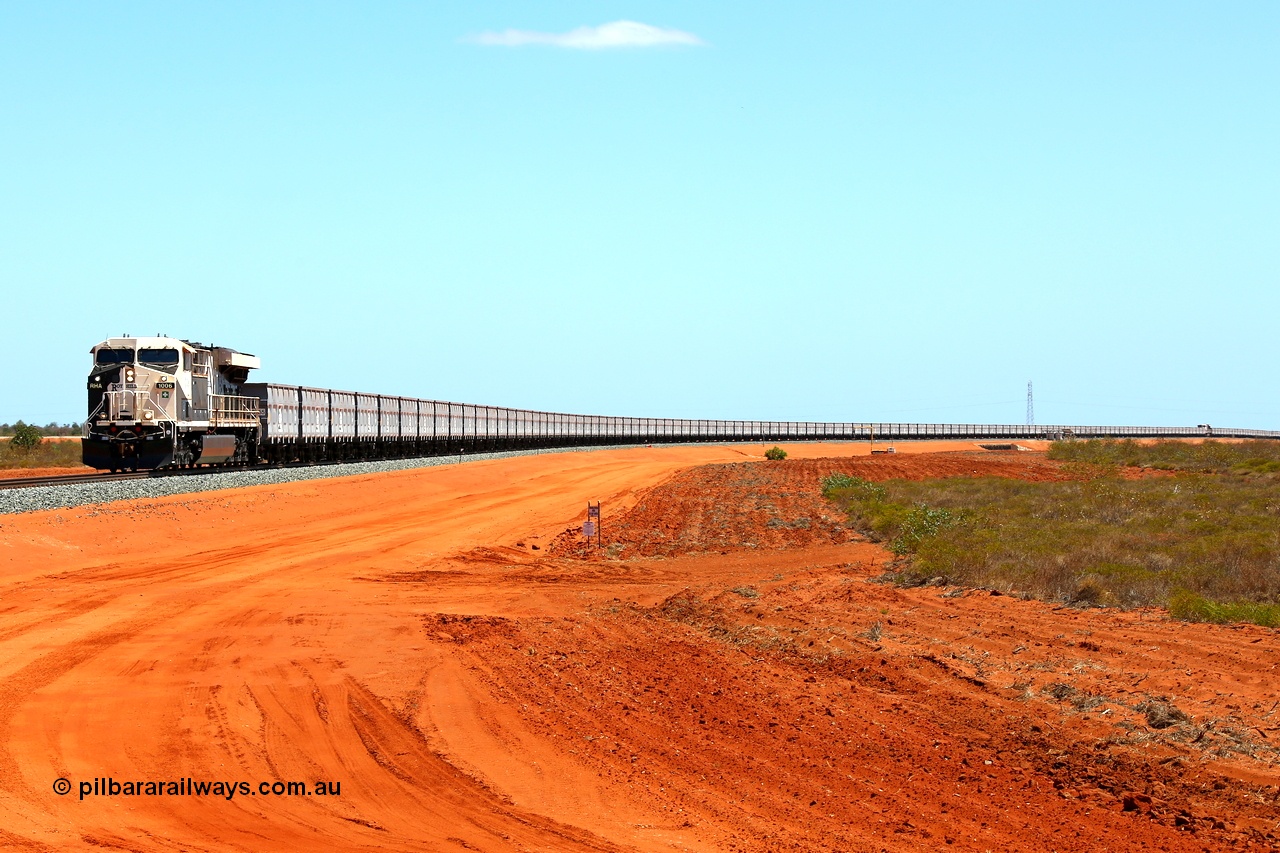160319 1907
Great Northern Hwy, 18.2 km grade crossing, Roy Hill empty train #96 with General Electric built ES44ACi unit RHA 1006 serial 62578 leading 116 ore waggons with a mid-train unit visible then another 116 ore waggons. 16th March 2016. [url=https://goo.gl/maps/nEXZaaAHHa12]View map here[/url].
Keywords: RHA-class;RHA1006;GE;ES44ACi;62578;