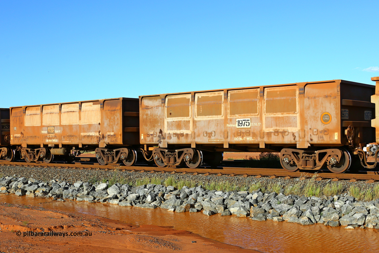 01975-02976 200410 5277
FMG 1975 and 2976 seen at Boodarie on an empty train, April 10, 2020. Original orders for 976 waggons numbered from 1001 slave and 2002 control up to 1975 slave and 2976 control built by CSR Zhuzhou Rolling Stock Works in 2007 and 2008 across two orders one for 816 waggons and the second for 160 waggons.
Keywords: 1975-2976;CSR-Zhuzhou-Rolling-Stock-Works;FMG-ore-waggon;