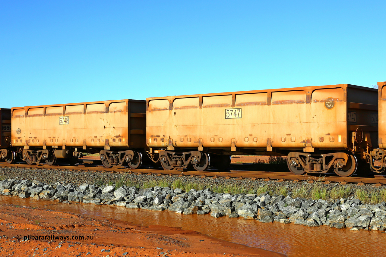 05747-06748 200410 5222
FMG 5747 and 6748 at Boodarie on an empty train, April 10, 2020. 282 waggons numbered 5747 slave and 6748 control, up to 7029 slave and 8030 control built by CSR Yangtze Rolling Stock Co., Ltd. in 2013.
Keywords: 5747-6748;CSR-Yangtze-Rolling-Stock-Co-Ltd;FMG-ore-waggon;