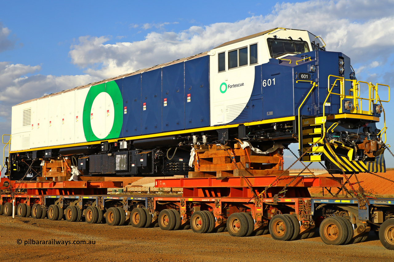 r251209 4846
Fortescue's new battery electric locomotive 601 being delivered to site after being built Progress Rail's EMD facility in Sete Lagoas, Brazil with a build date of October 2025 and serial number 20218349-001. These units tip the scales at 265 tonnes for a projected output of 7,600 horse power. December 9, 2025.
